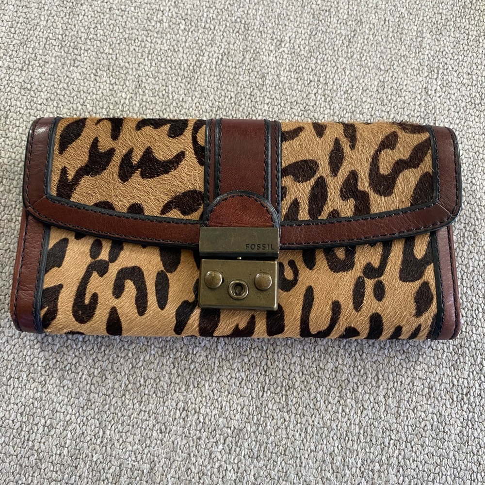 Fossil trifold animal print wallet of leather and fur.